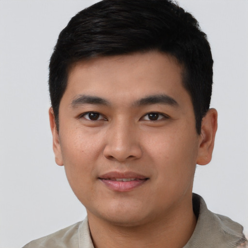 Joyful white young-adult male with short  black hair and brown eyes