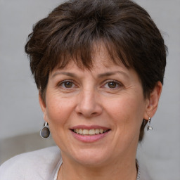 Joyful white adult female with short  brown hair and brown eyes