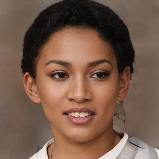 Joyful latino young-adult female with short  black hair and brown eyes