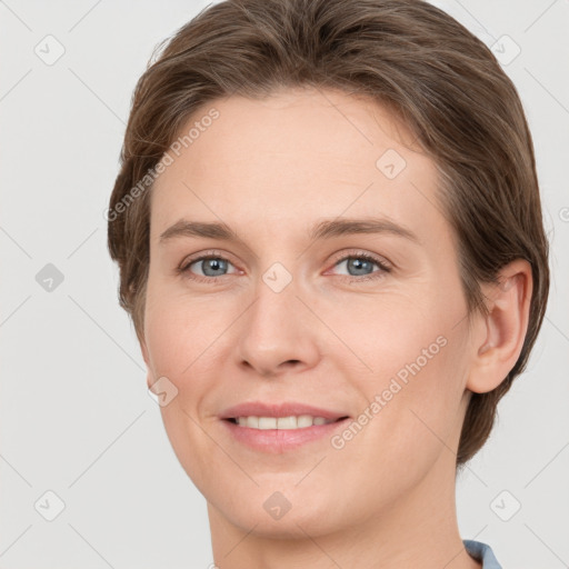 Joyful white young-adult female with short  brown hair and grey eyes