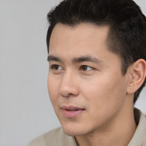 Neutral asian young-adult male with short  black hair and brown eyes