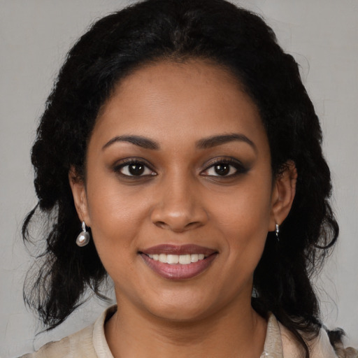 Joyful black young-adult female with medium  black hair and brown eyes