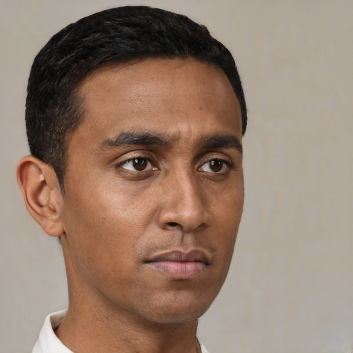 Neutral black young-adult male with short  black hair and brown eyes