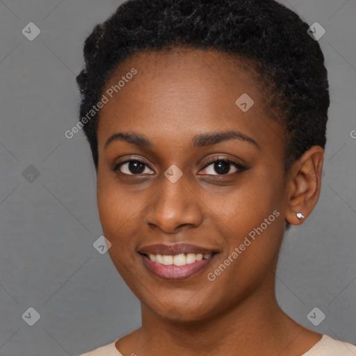 Joyful black young-adult female with short  black hair and brown eyes