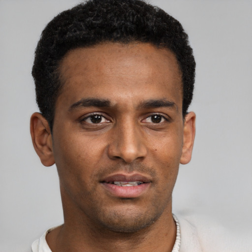 Neutral black young-adult male with short  brown hair and brown eyes