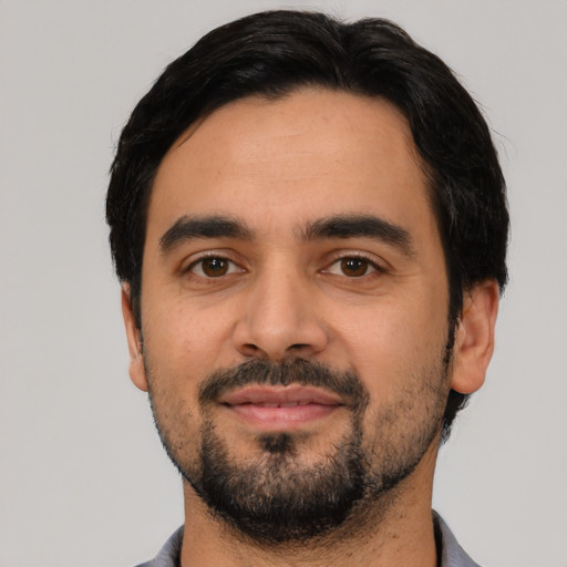 Neutral latino young-adult male with short  black hair and brown eyes