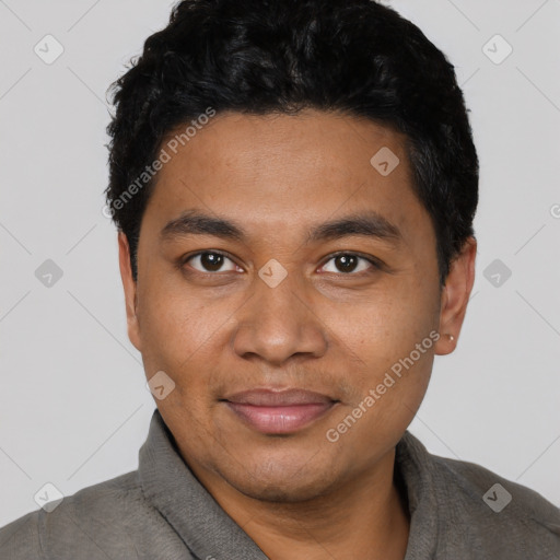 Joyful black young-adult male with short  black hair and brown eyes