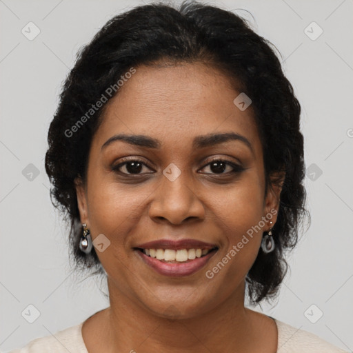 Joyful black adult female with short  brown hair and brown eyes