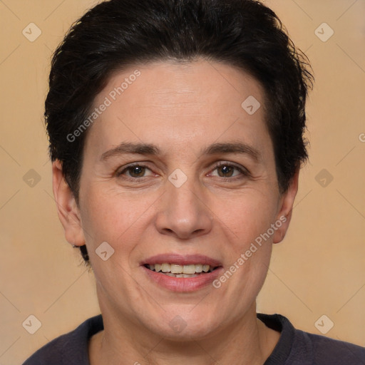 Joyful white adult female with medium  brown hair and brown eyes