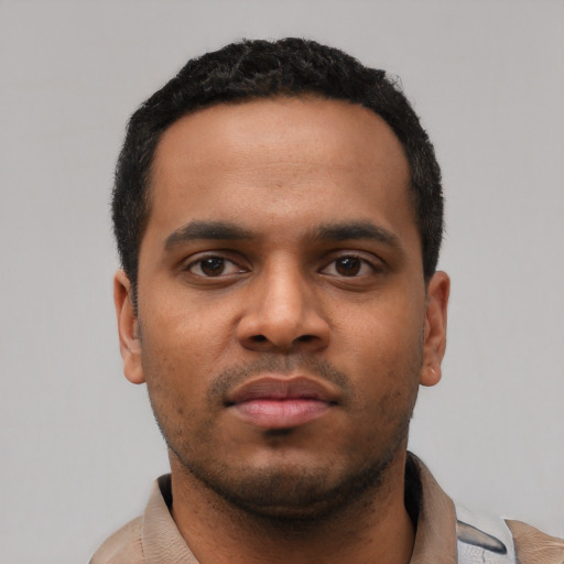 Neutral latino young-adult male with short  black hair and brown eyes