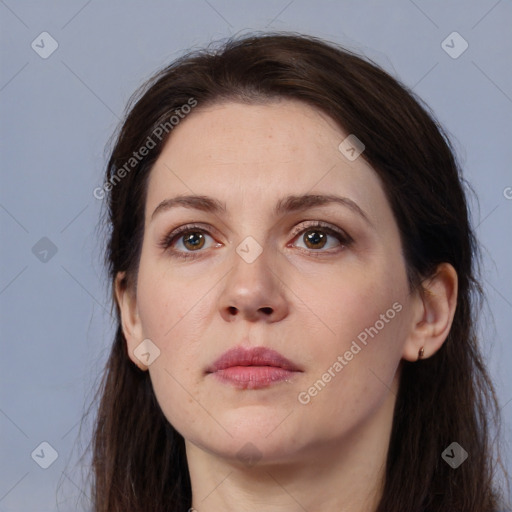 Neutral white young-adult female with long  brown hair and brown eyes