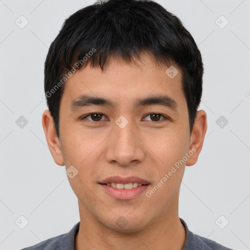 Joyful asian young-adult male with short  black hair and brown eyes