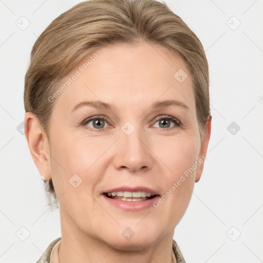 Joyful white adult female with medium  brown hair and grey eyes