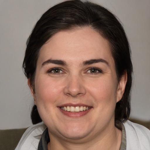 Joyful white young-adult female with medium  brown hair and brown eyes