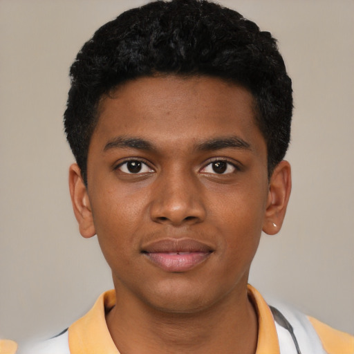 Joyful latino child male with short  black hair and brown eyes