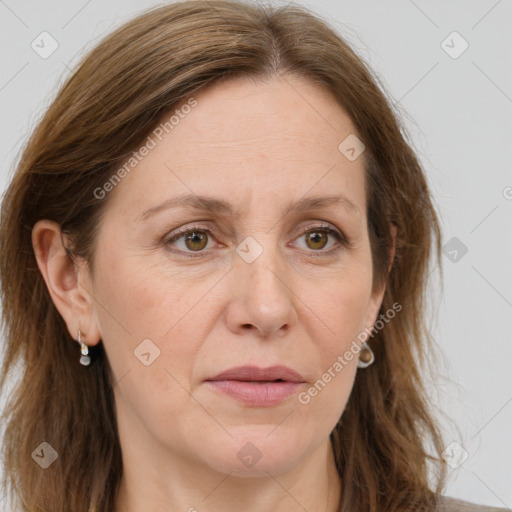 Joyful white adult female with long  brown hair and grey eyes