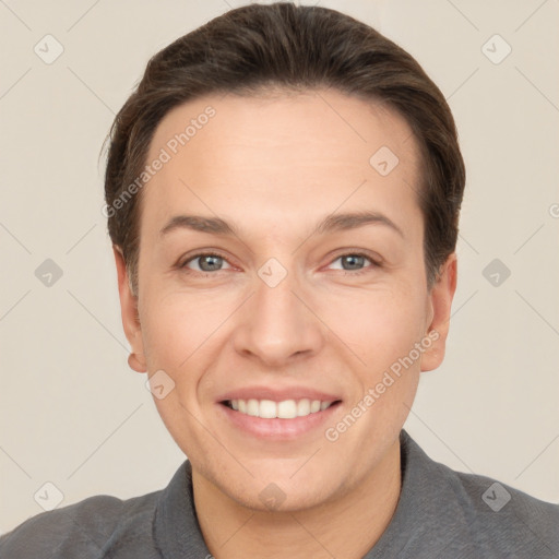 Joyful white adult female with short  brown hair and brown eyes