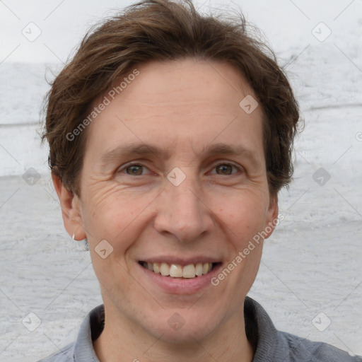 Joyful white adult male with short  brown hair and grey eyes