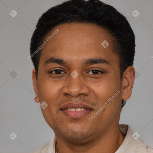 Joyful latino young-adult male with short  black hair and brown eyes