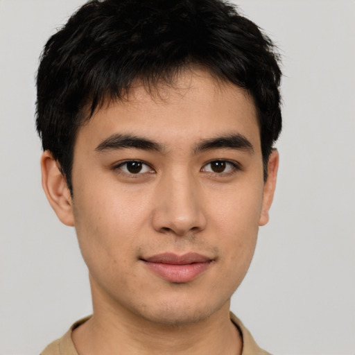 Joyful asian young-adult male with short  brown hair and brown eyes