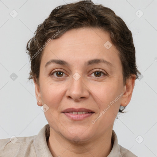 Joyful white adult female with short  brown hair and grey eyes