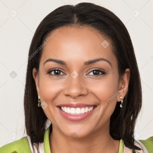 Joyful latino young-adult female with medium  brown hair and brown eyes