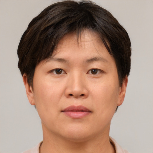 Neutral asian young-adult female with short  brown hair and brown eyes