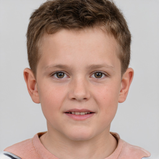 Joyful white child male with short  brown hair and grey eyes