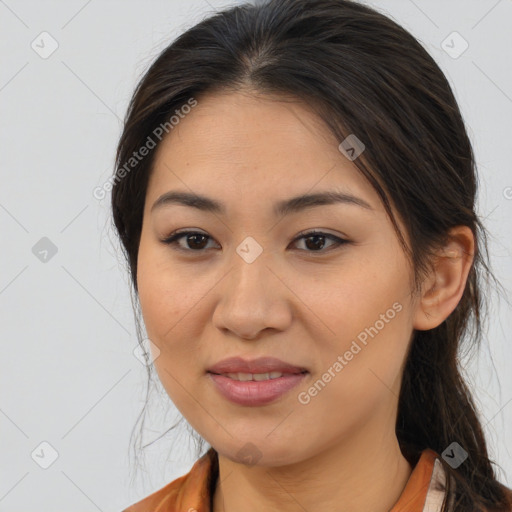 Joyful latino young-adult female with medium  brown hair and brown eyes