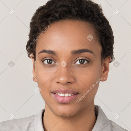 Joyful black young-adult female with short  brown hair and brown eyes