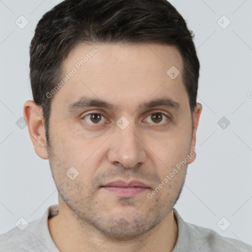 Joyful white adult male with short  brown hair and brown eyes