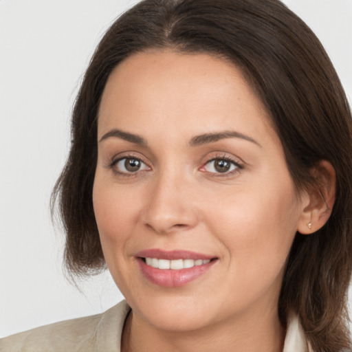 Joyful white young-adult female with medium  brown hair and brown eyes