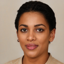 Joyful latino young-adult female with short  black hair and brown eyes