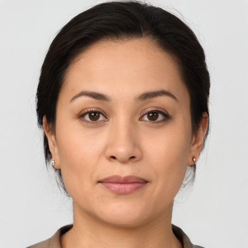 Joyful white young-adult female with medium  brown hair and brown eyes