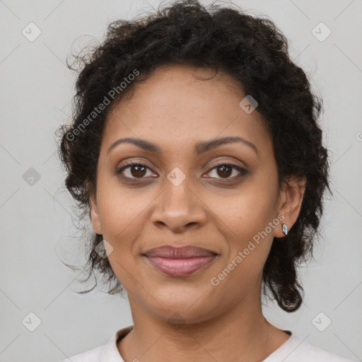 Joyful black young-adult female with medium  brown hair and brown eyes