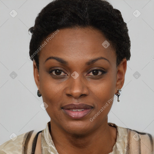 Joyful black young-adult female with short  black hair and brown eyes