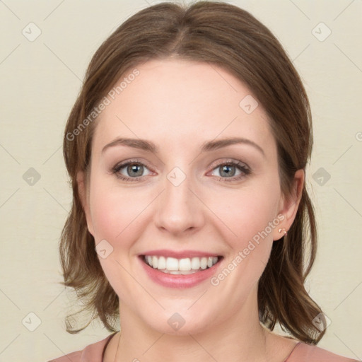 Joyful white young-adult female with medium  brown hair and green eyes