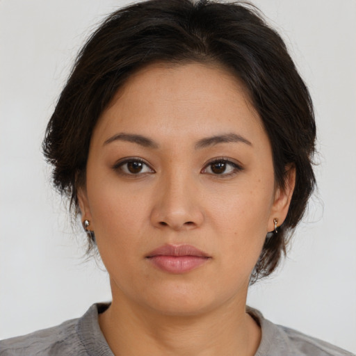 Neutral asian young-adult female with medium  brown hair and brown eyes
