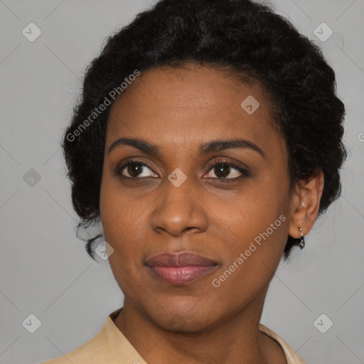 Joyful black young-adult female with short  black hair and brown eyes