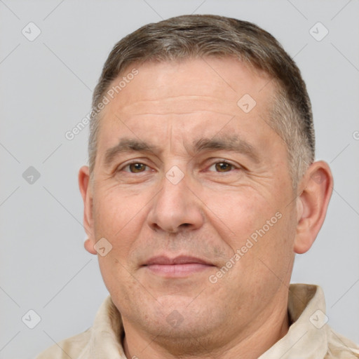 Joyful white adult male with short  brown hair and brown eyes