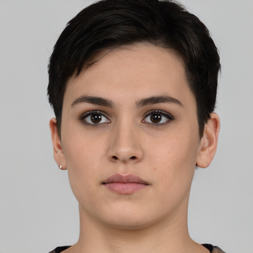 Neutral white young-adult female with short  black hair and brown eyes