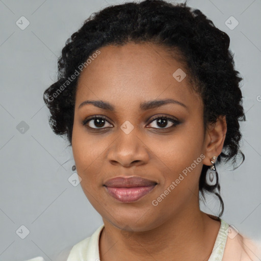 Joyful black young-adult female with medium  black hair and brown eyes