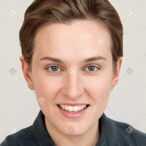 Joyful white young-adult female with short  brown hair and grey eyes