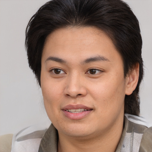 Joyful asian young-adult female with medium  brown hair and brown eyes