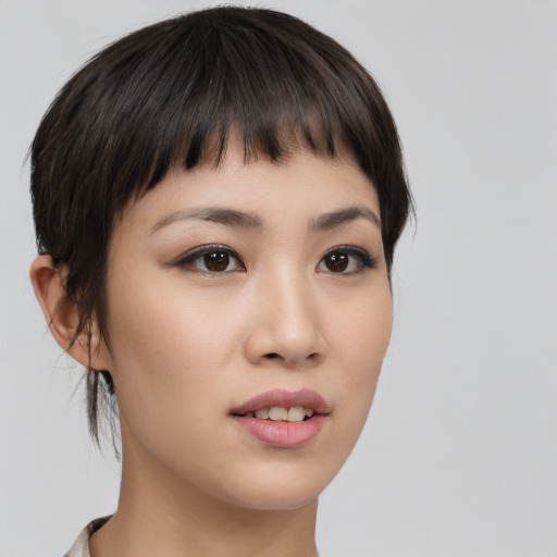 Joyful asian young-adult female with short  brown hair and brown eyes