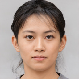 Neutral asian young-adult female with medium  brown hair and brown eyes