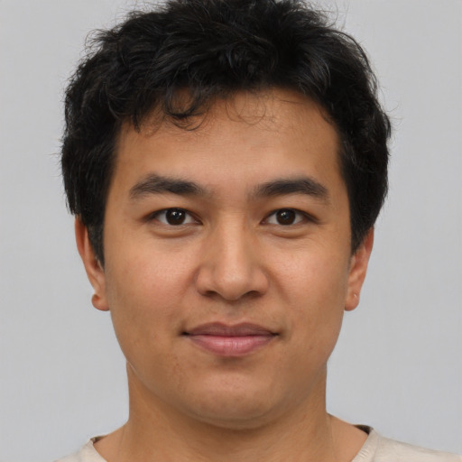 Joyful asian young-adult male with short  brown hair and brown eyes