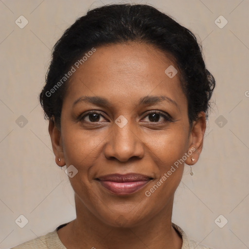 Joyful black adult female with short  brown hair and brown eyes