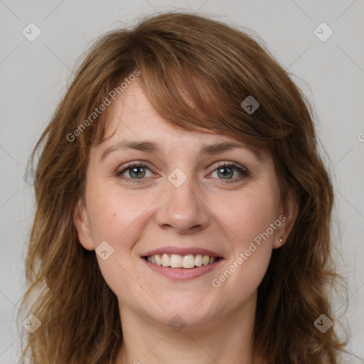 Joyful white young-adult female with medium  brown hair and blue eyes