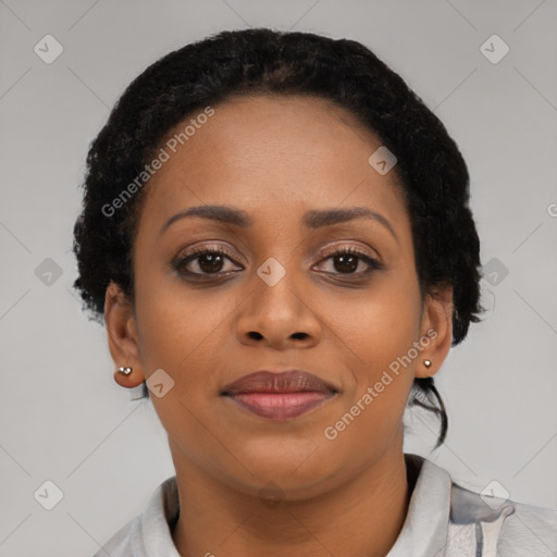 Joyful black young-adult female with short  brown hair and brown eyes